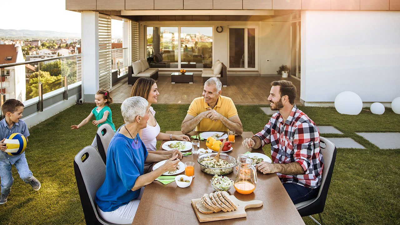 Family having dinner at their backyard