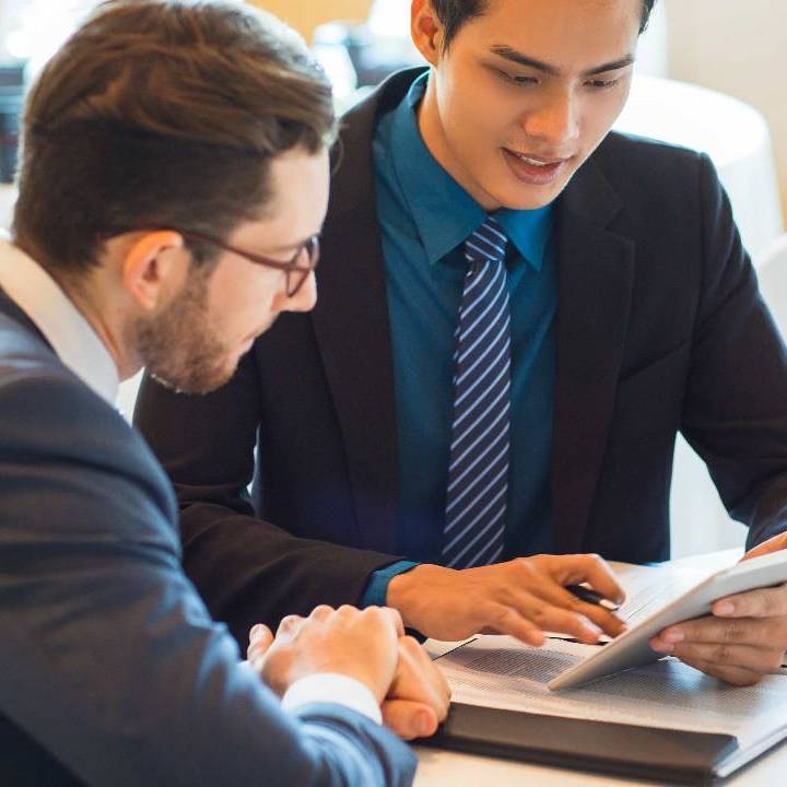 two content business partners discussing issue