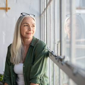 Woman looking through the window