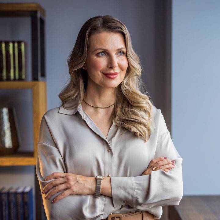 Woman standing looking through the window